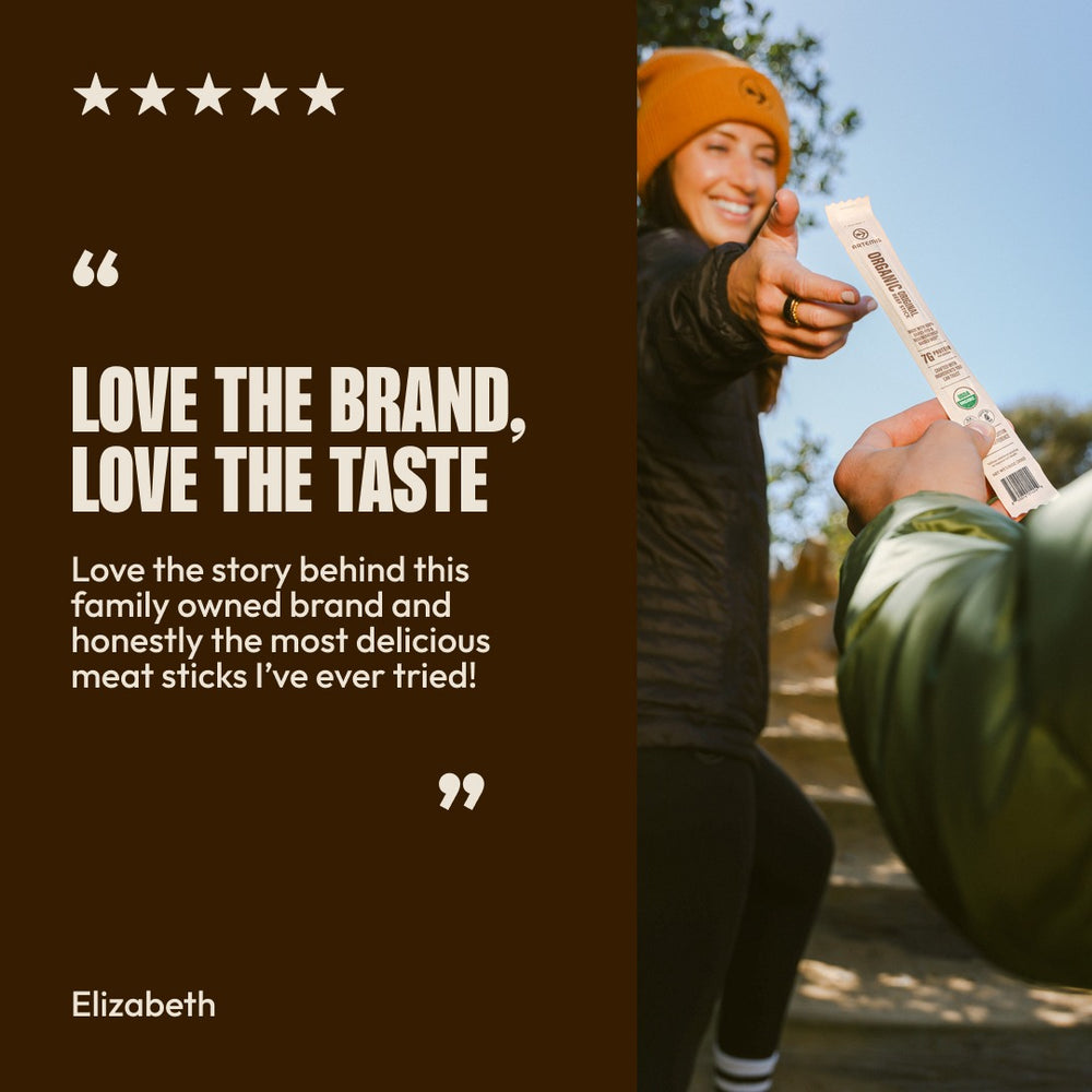 Five-star review from Elizabeth: Love the brand, love the taste. Love the story behind this family owned brand and honestly the most delicious meat sticks I've ever tried! Beside a smiling woman in a beanie holding out an Organic Original Beef Stick.